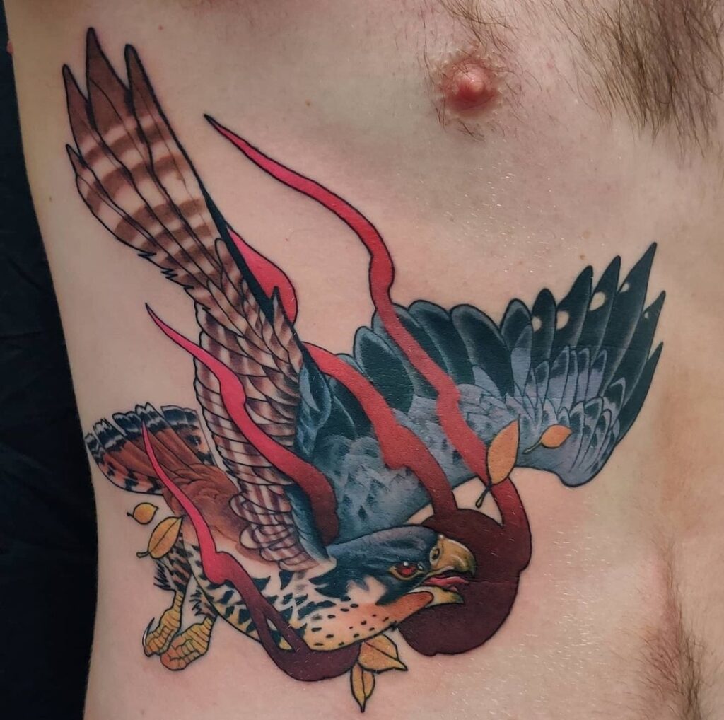 Neo-traditionele valk met rode linten op de ribben.