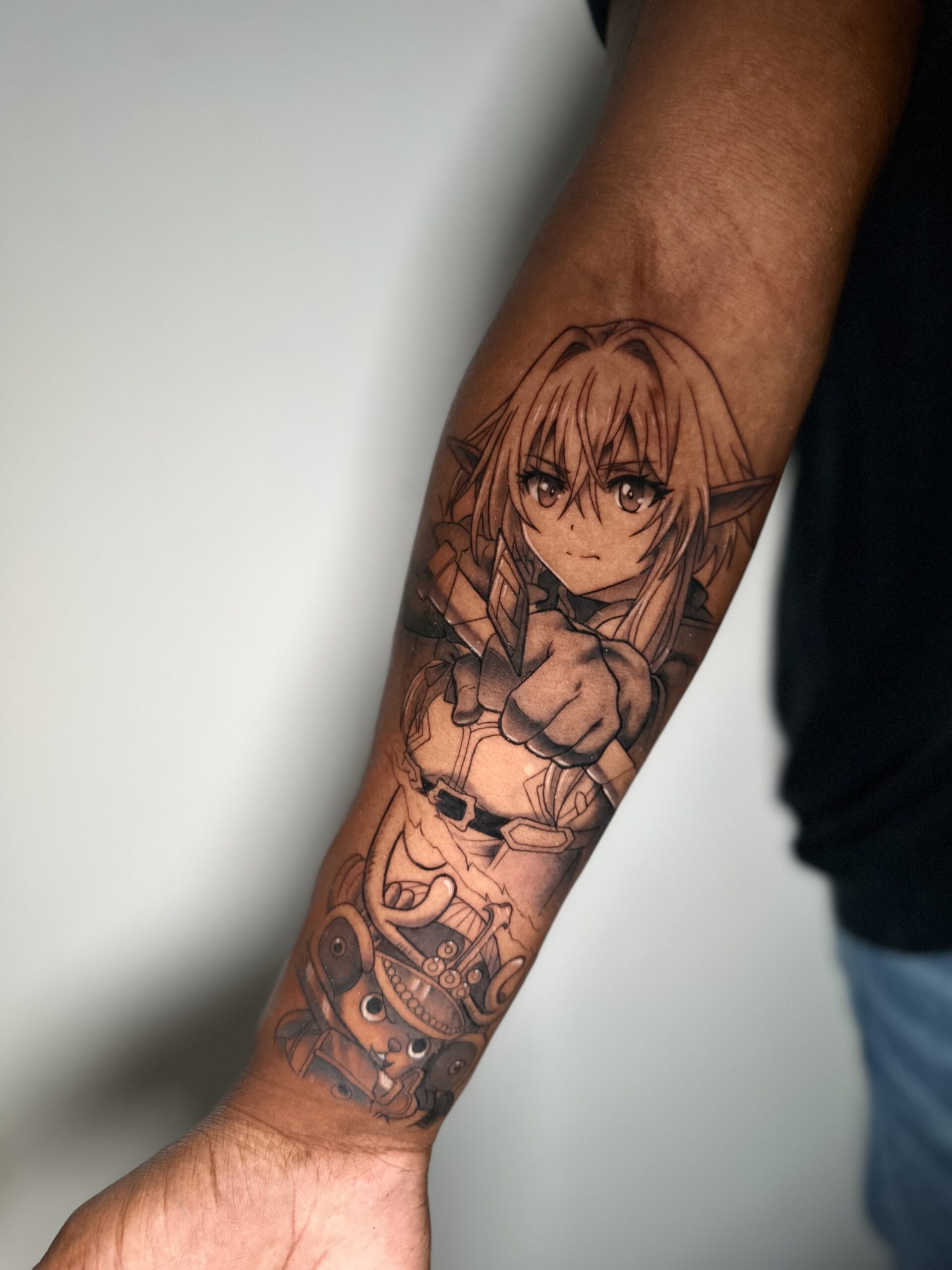 Anime tattoo van High Elf Archer en Chopper op onderarm.